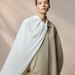 A cape with voluminous Culture sleeves